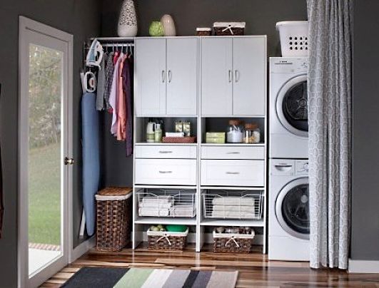 Laundry cabinets can be combined with storage of outdoor clothing and footwear, saving space for other purposes.