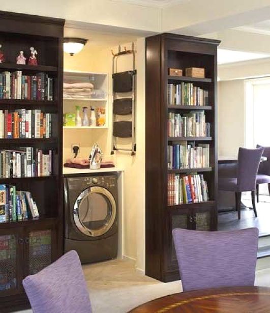 With appropriate design mini laundry cabinets may even be installed in living rooms. Using book shelves and heavy doors hides the equipment away and reduces noise.